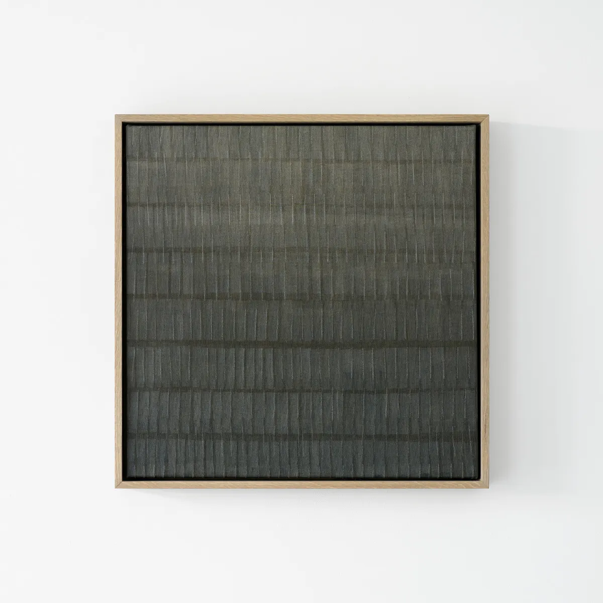 Minimalist contemporary painting by Marta Rószczka, dark grey-blue acrylic on canvas with horizontal brushstrokes in oak framed canvas.